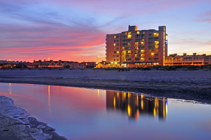 beachfront hotel in ocean city at dusk