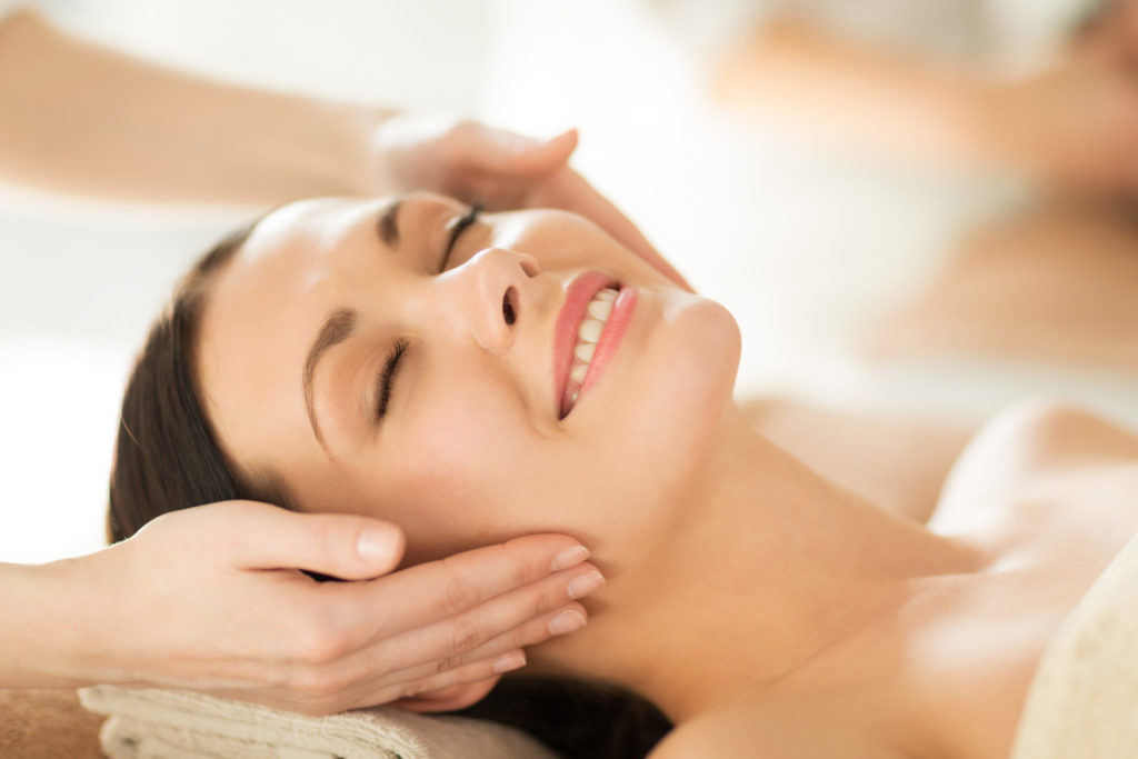 woman smiling at a spa