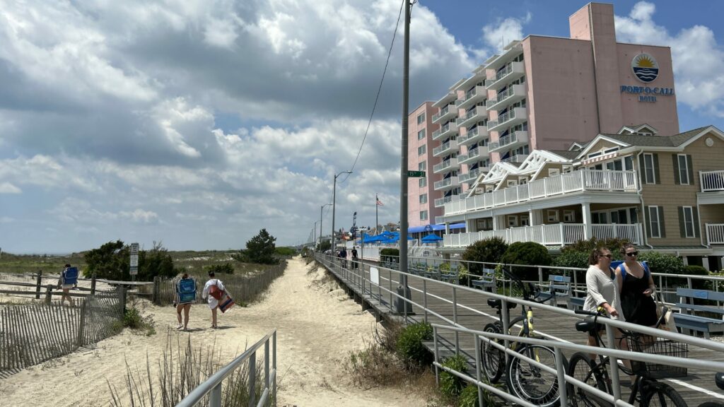 The Port-O-Call hotel to the right of the boardwalk with the beach to the left