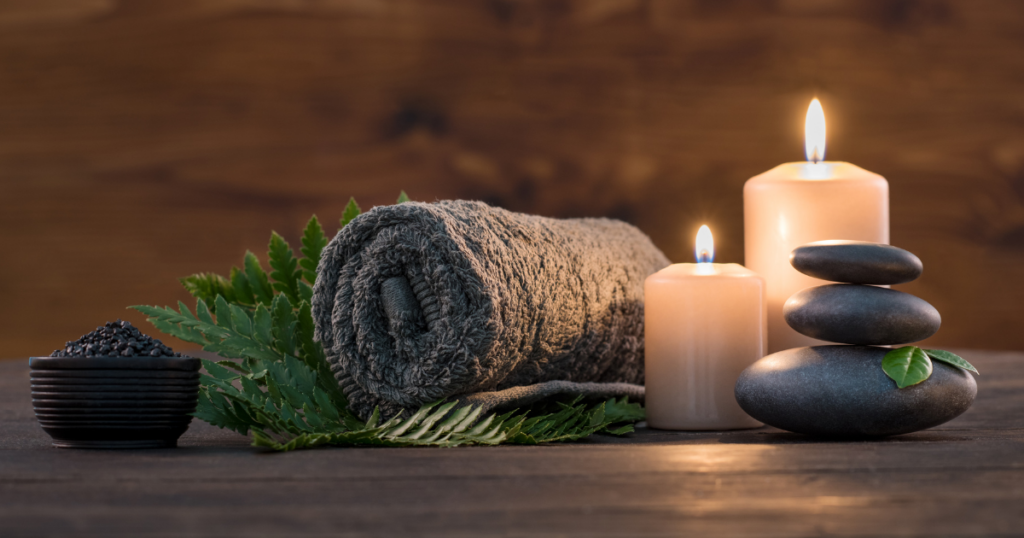 Towel with candles and stones at a spa